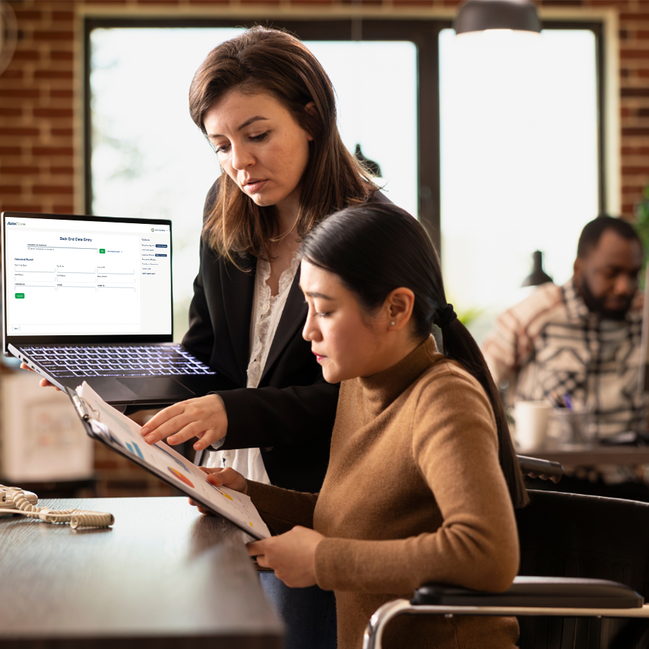 office workers reviewing laptop tpa
