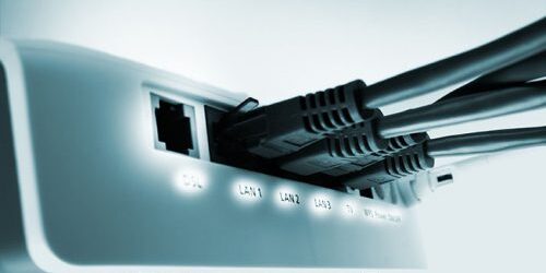 close up of a home network switch with free DSL port und puged in network cables , black and whit